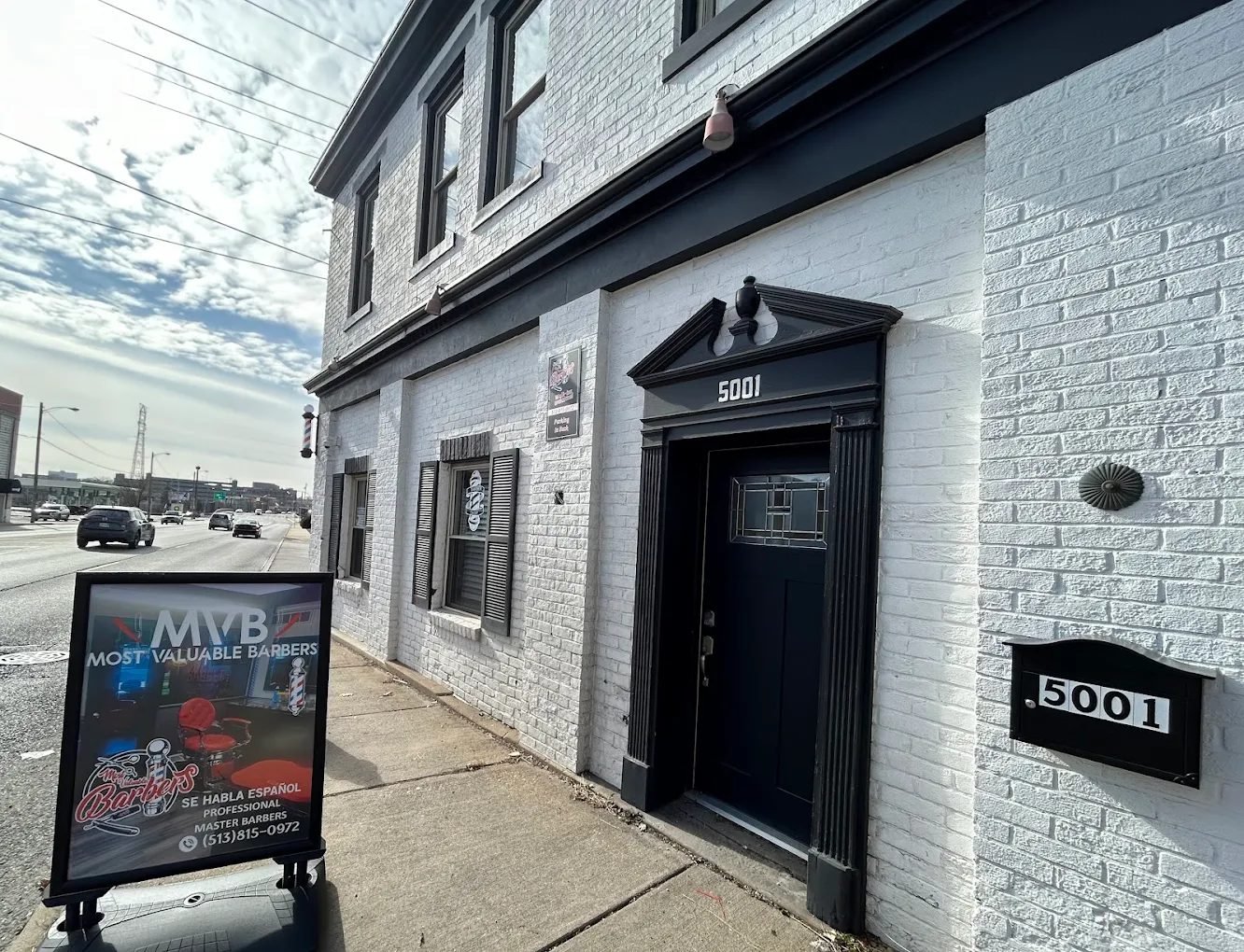 MVB storefront at 5001 Montgomery Rd with the shop sign on the sidewalk